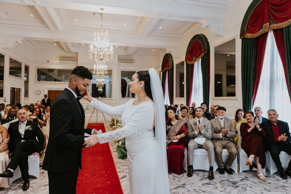 Wedding reception montage showing elegant white and red decor with chandeliers in a luxurious ballroom venue.