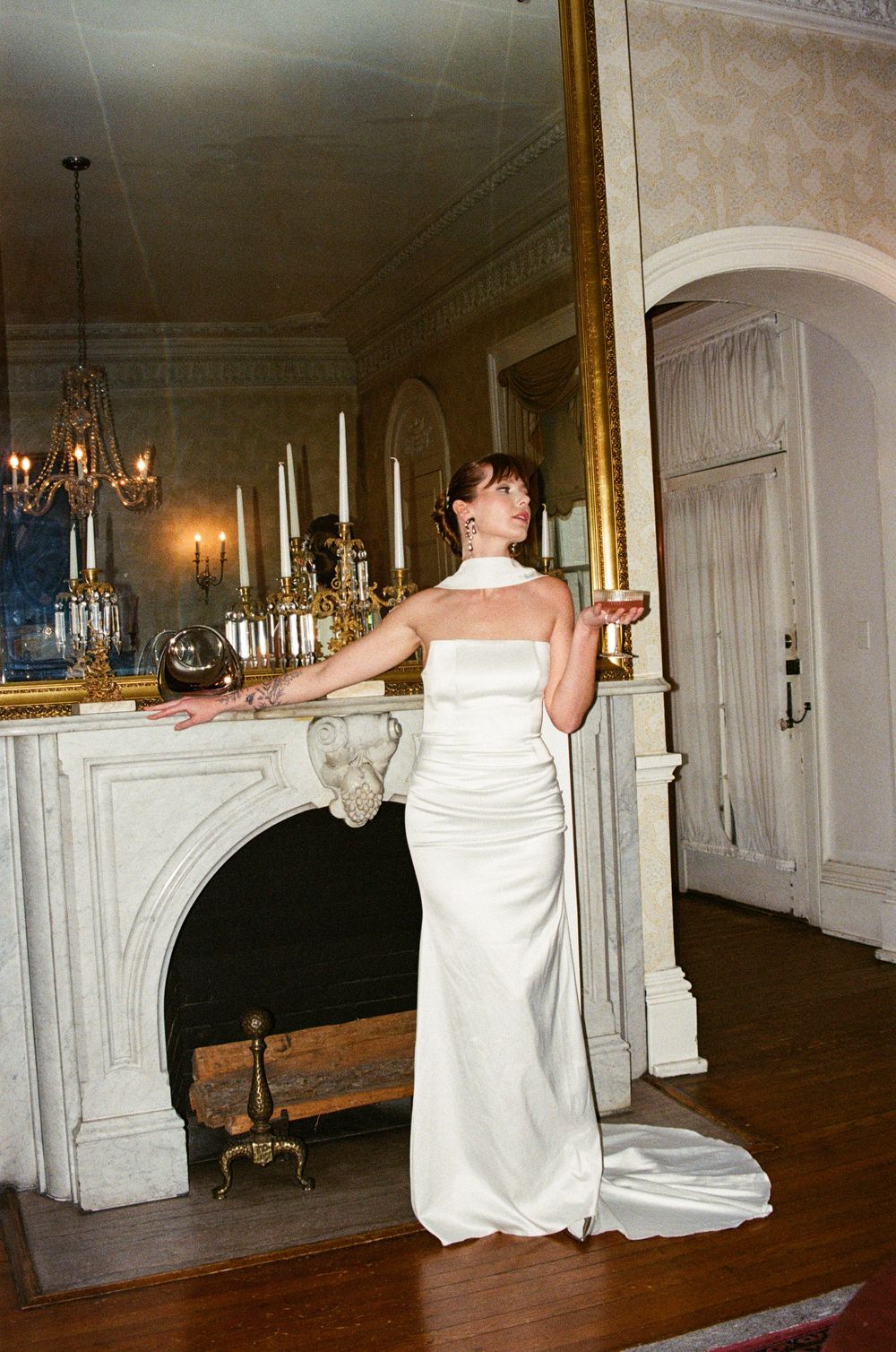 A series of photos showing spa goers in white robes relaxing in an elegant room with chandeliers and wooden floors.