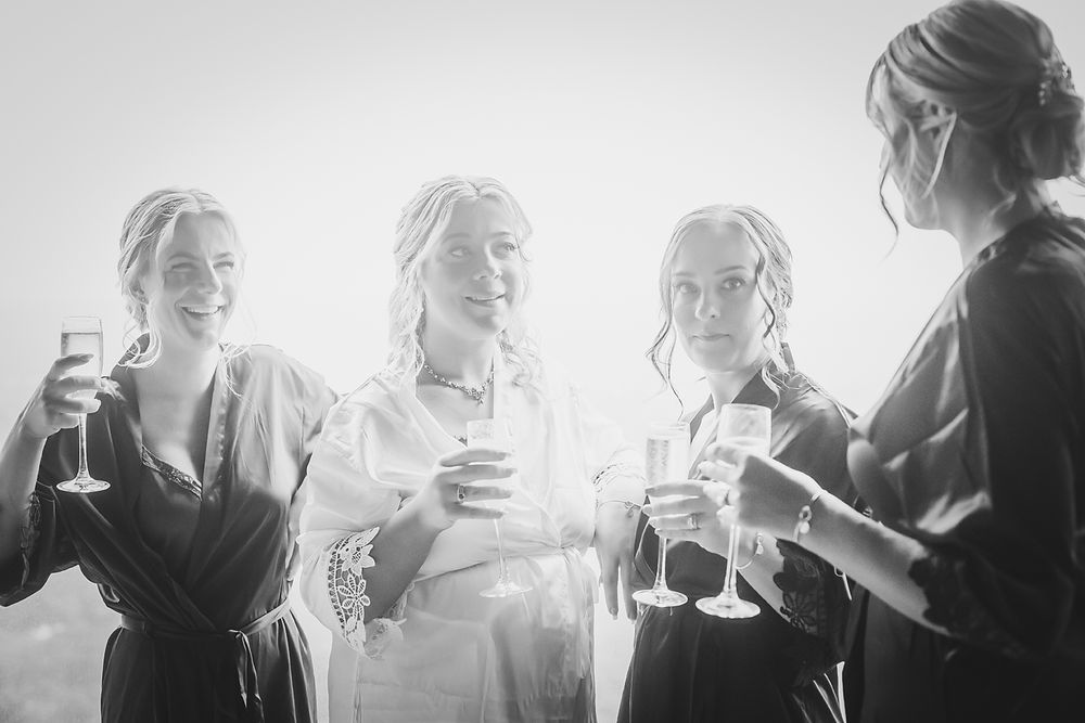 A row of black and white portrait photographs with dramatic lighting shows multiple individuals in profile view.