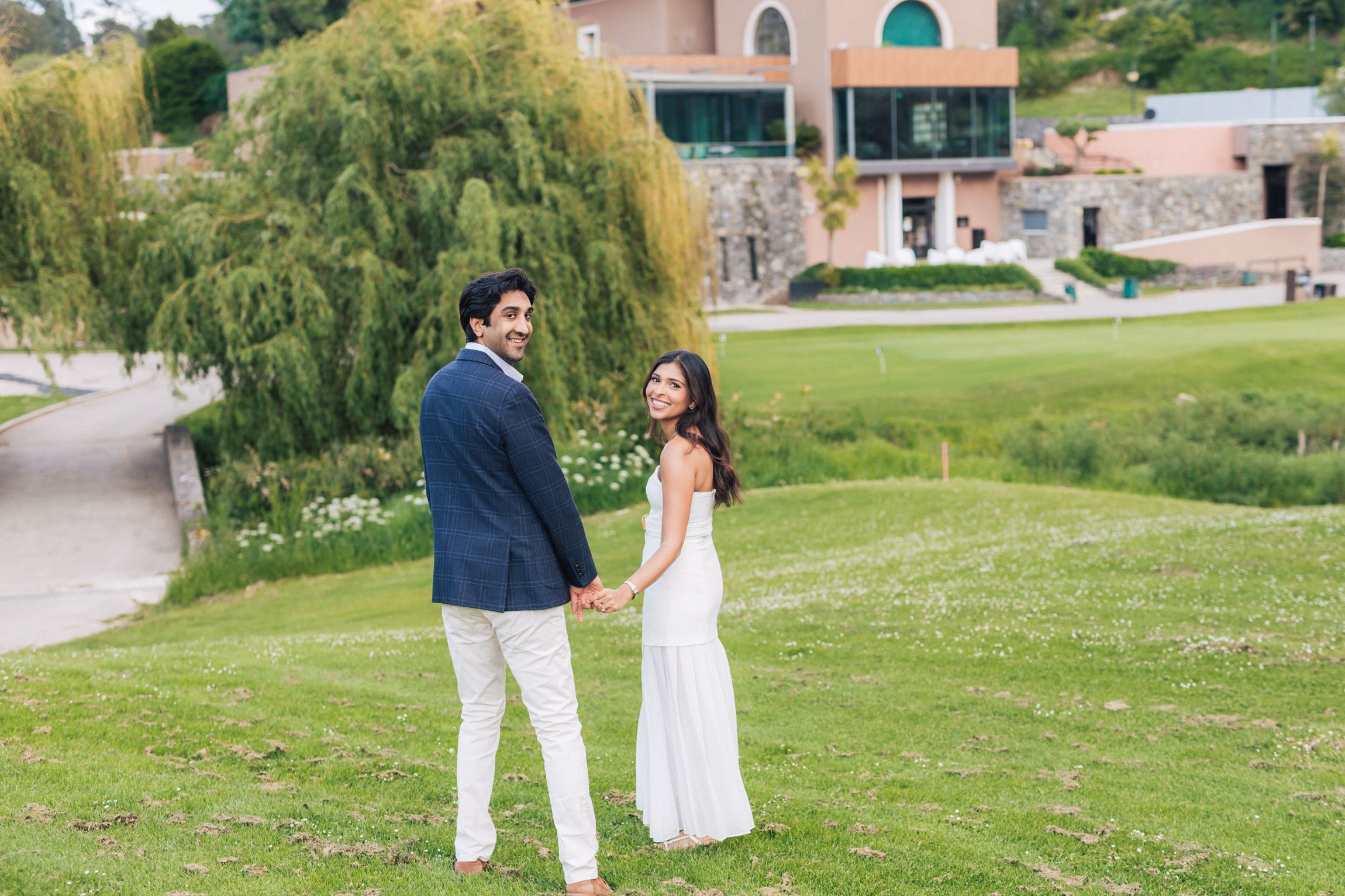 Romantic engagement photo-shoot in Sintra, Portugal, with an Indian couple exploring Penha Longa. By a destination wedding Photographer