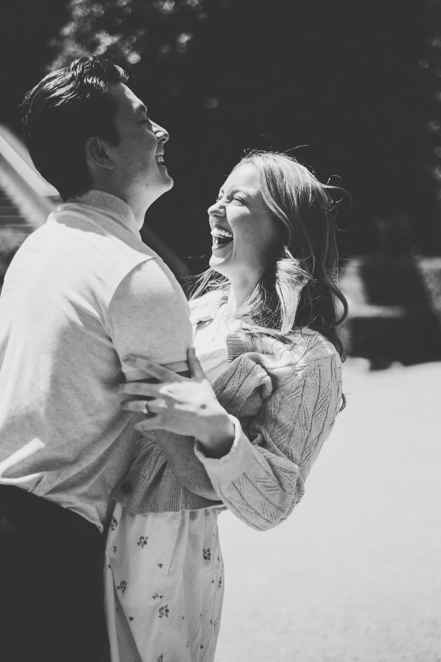 Black and white series of romantic photos showing a couple dancing together in an intimate embrace outdoors.
