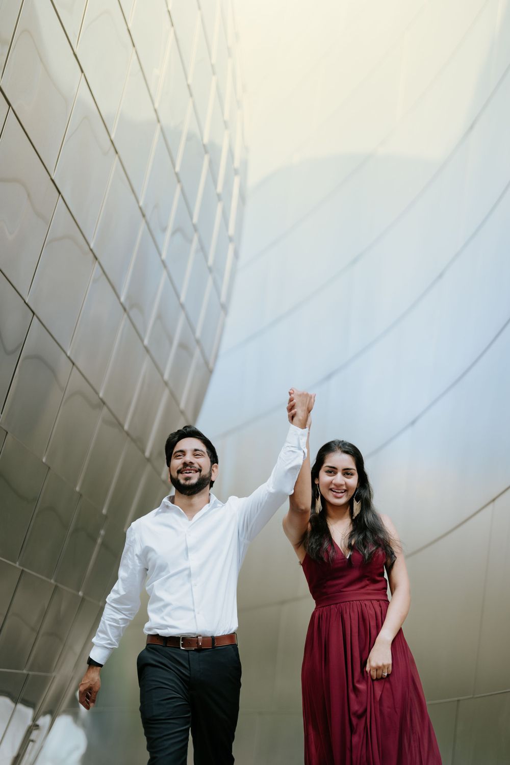 Engagement shoot of an Indian couple at Walt Disney Concert Hall in Los Angeles, captured by a Dallas Indian wedding photographer.