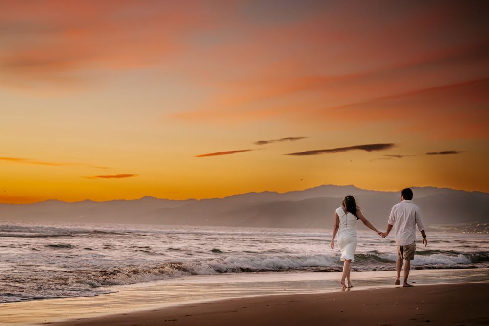 Engaged Indian couple photoshoot at a Los Angeles beach, captured by a Dallas Indian wedding photographer.