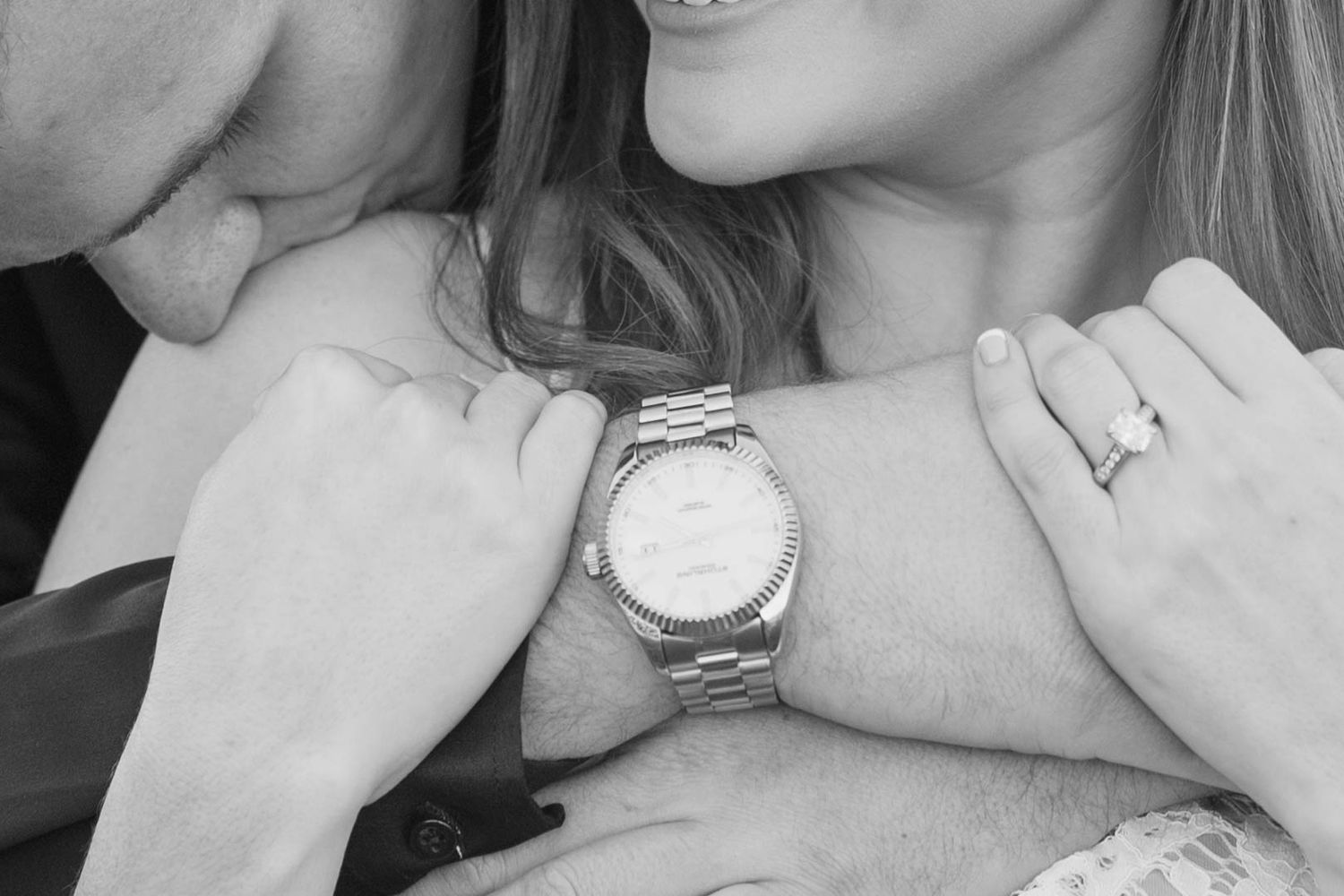 Several intimate black and white photos showing wedding rings and tender moments between partners getting engaged.