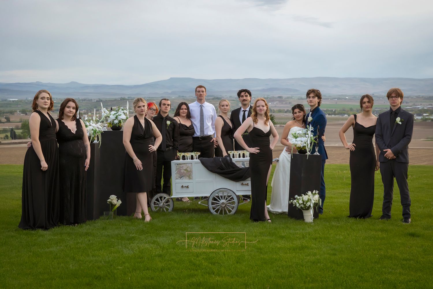 Beverage Cart Idaho Tipsy Trailers with bridal party posing around it wearing formal black and white
