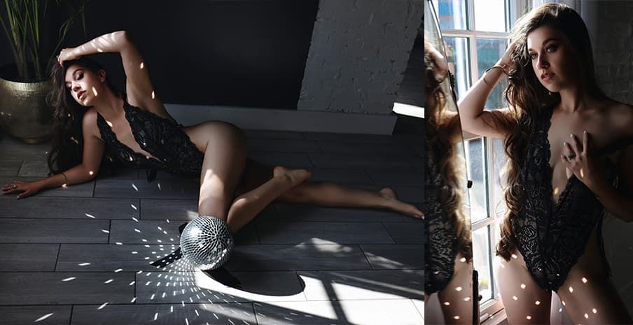 Dramatic boudoir photography with light streaming through window creating artistic shadows on dark floor.