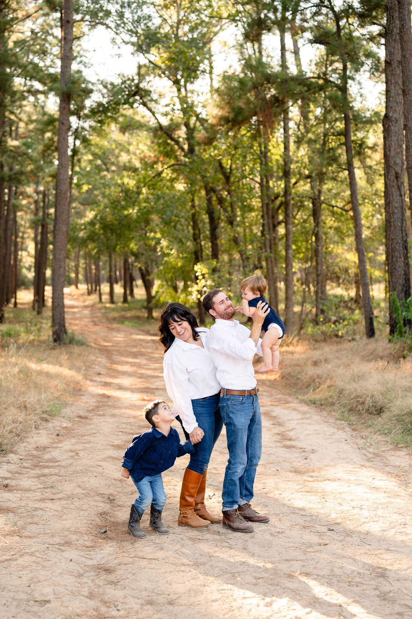 Family photo sequence showing playful interaction on a winding dirt path through a sunlit pine forest.