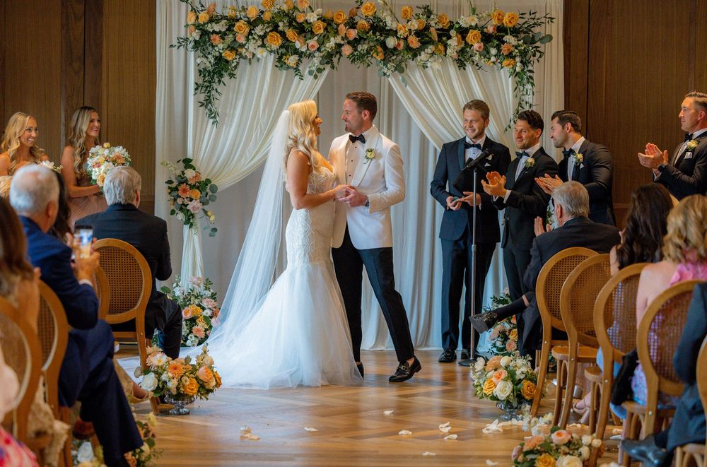 Wedding reception details at Book Tower Detroit with elegant table settings and city skyline views.