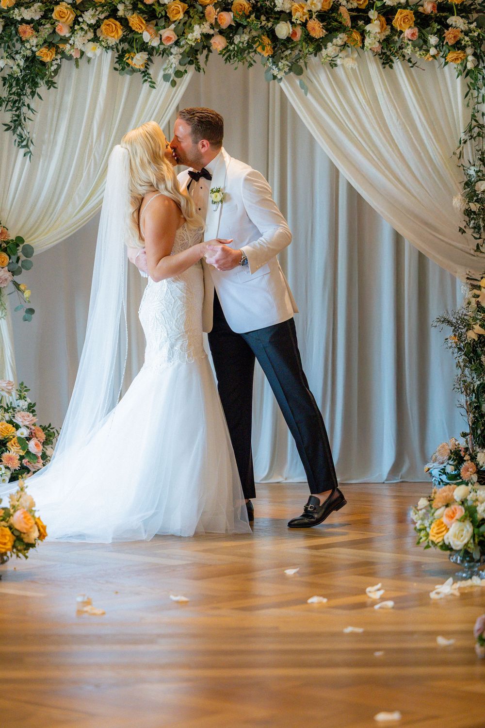 Candid wedding photos of the bride and groom celebrating at their Book Tower Detroit reception.