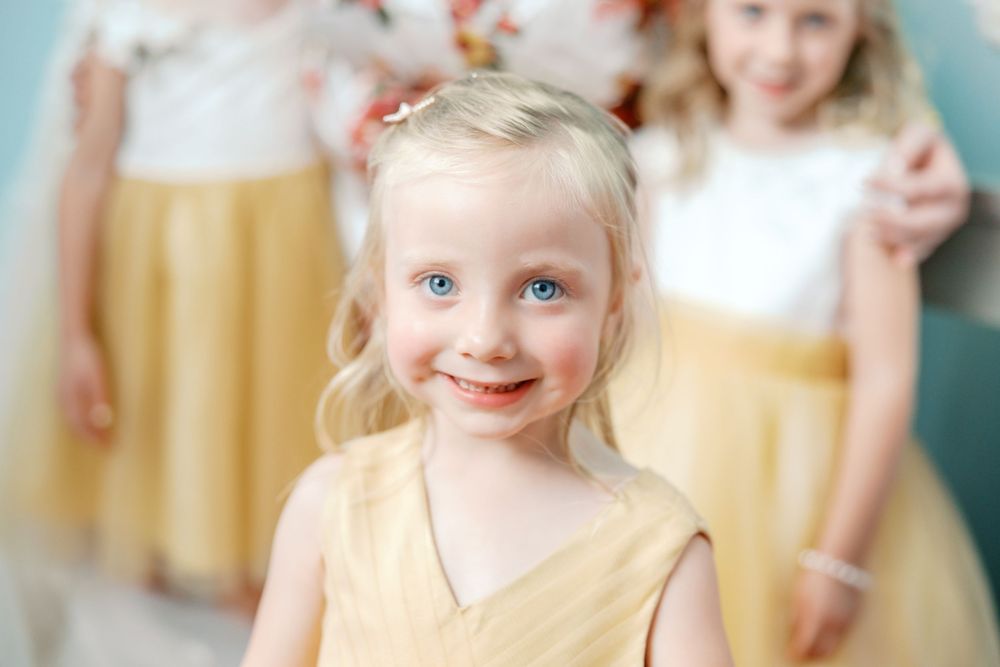 A collage of children celebrating at a party, blowing bubbles and laughing together on a festive occasion.