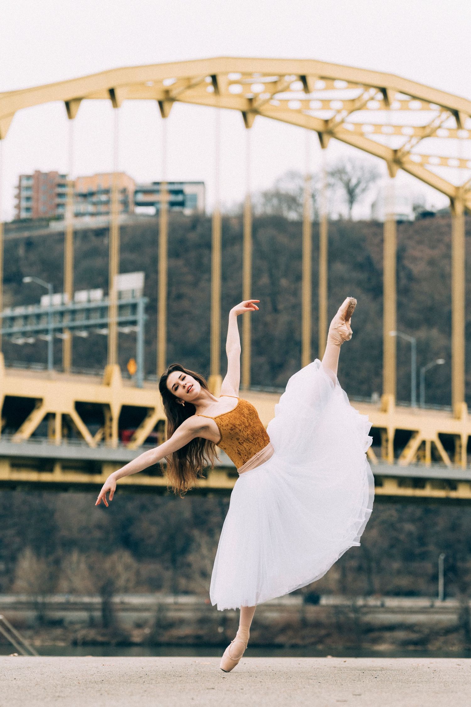 Ballerina dancer performing in urban Pittsburgh setting, showcasing fine art ballet dance photography