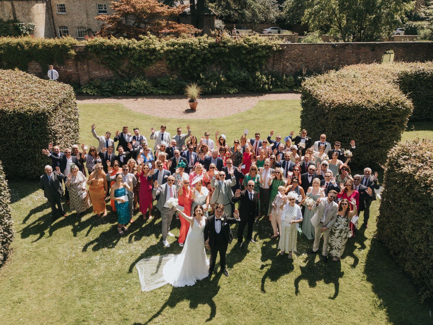 Large wedding gathering captured from above showing guests at Saltmarshe Hall - taken by Grimsby photographer.