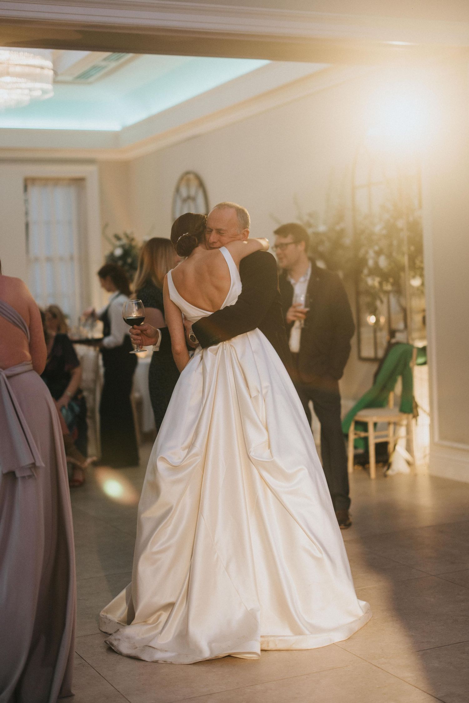 A bride and father share a dance at a wedding reception in an elegant ballroom at Saltmarshe Hall - taken by Grimsby photographer.