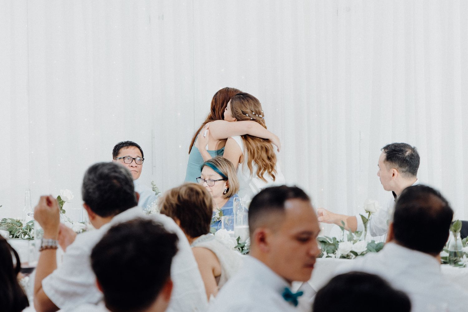 A candid moment captured during a wedding reception captured by Apertured Media Auckland Wedding Photographer.