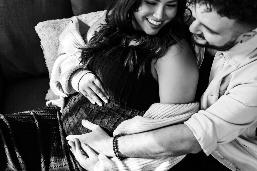 A tender black and white photo series showing intimate romantic moments between a couple.