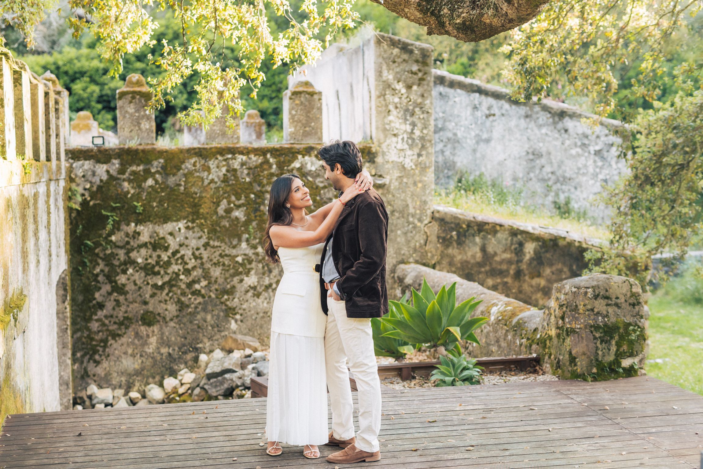 Romantic engagement photo-shoot in Sintra, Portugal, with an Indian couple exploring Penha Longa. By a destination wedding Photographer