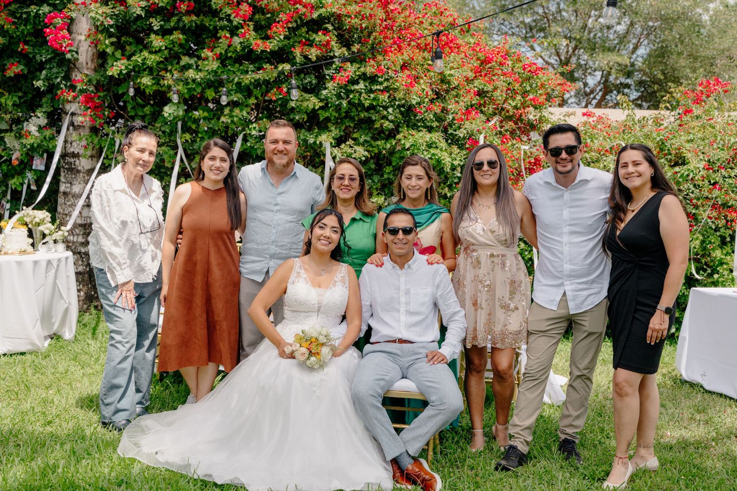 Four snapshots from an outdoor wedding ceremony with guests and decorations in a garden setting.