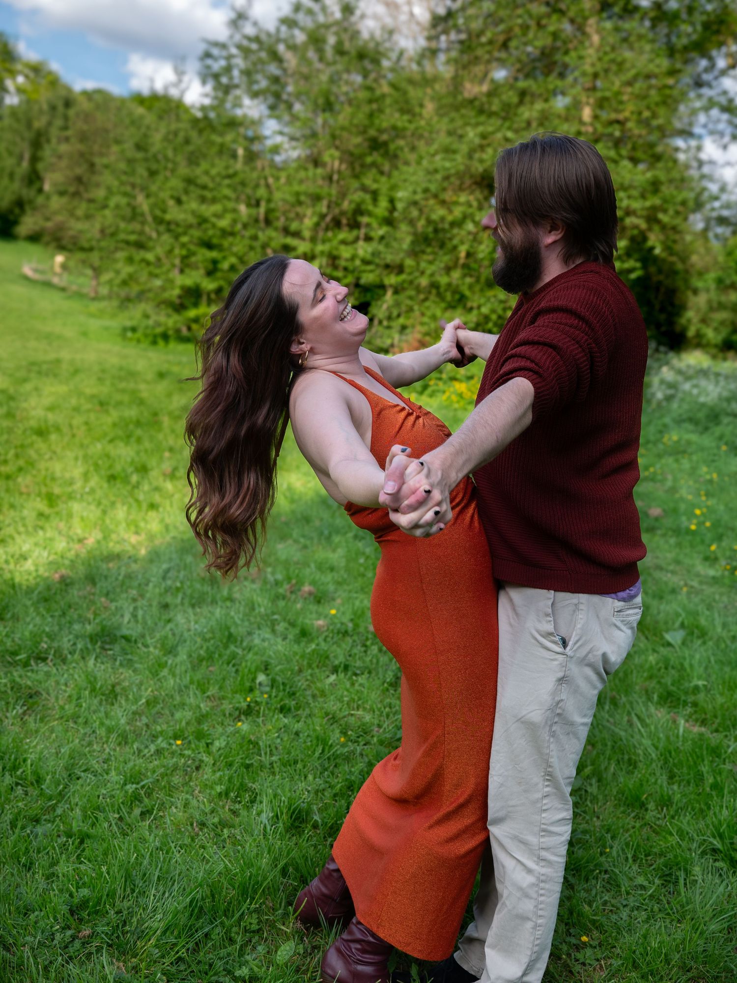 Couple laying on the grass in woodthorpe park nottingham connecting