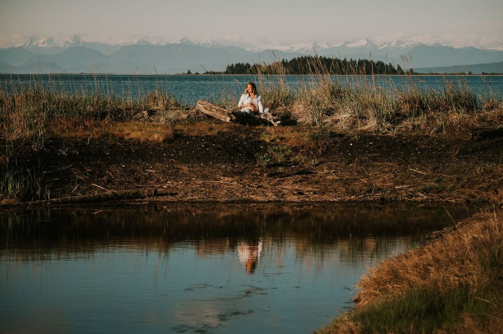 Maternity photoshoot in Comox Valley on Vancouver island creative reflection shot of pregnant woman outdoor natural light photographer