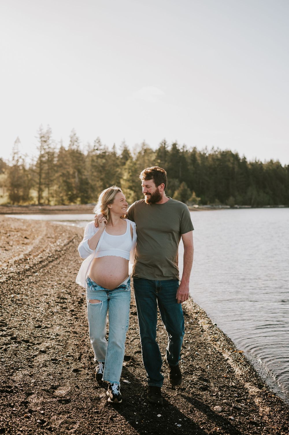 Maternity session couple walking and smiling in Union Bay on Vancouver island Maternity and Outdoor natural light photographer