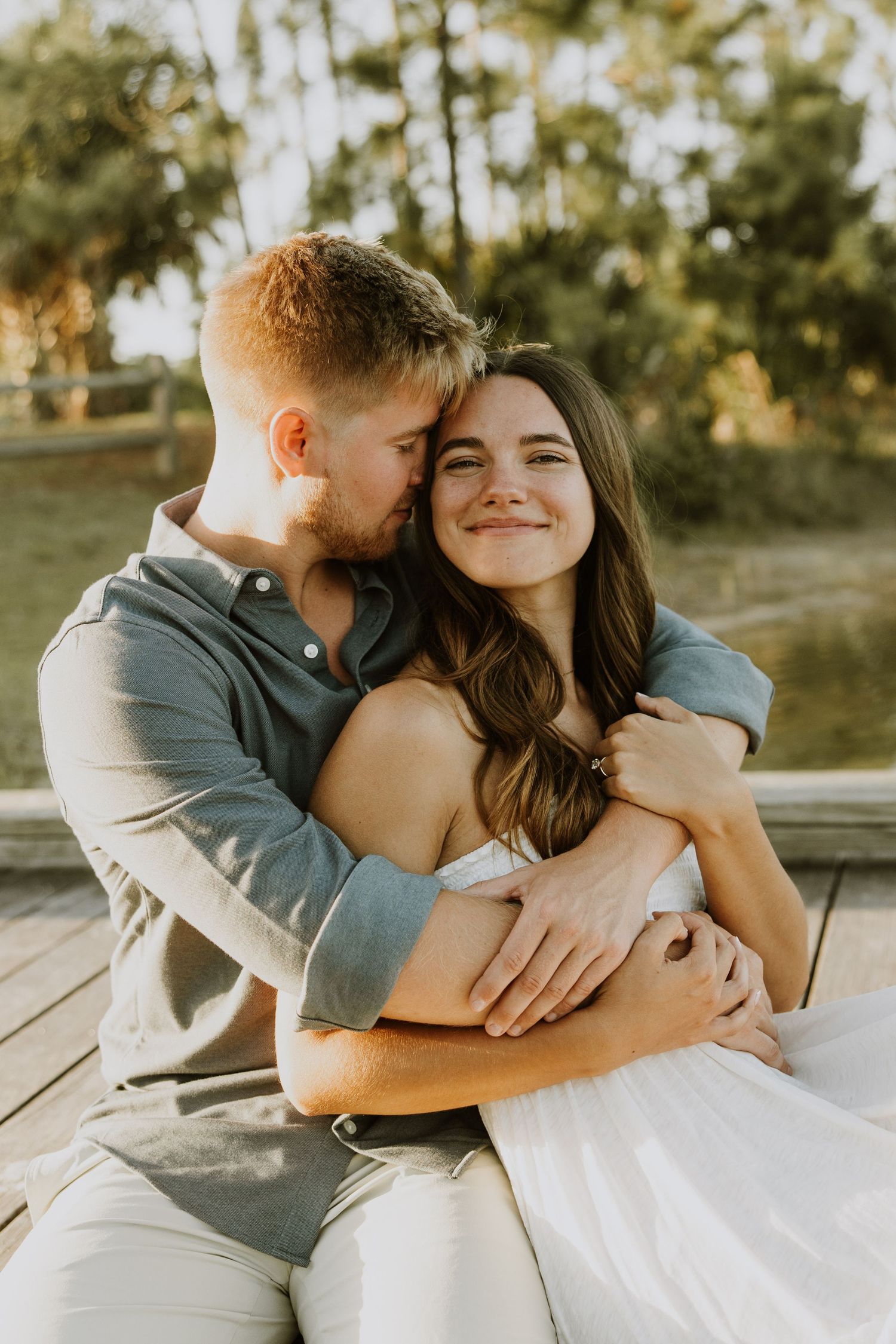 Golden hour Engagement photos captured by Lindsay McDow Photography in the greenery of a nature trail in West Palm Beach, Florida