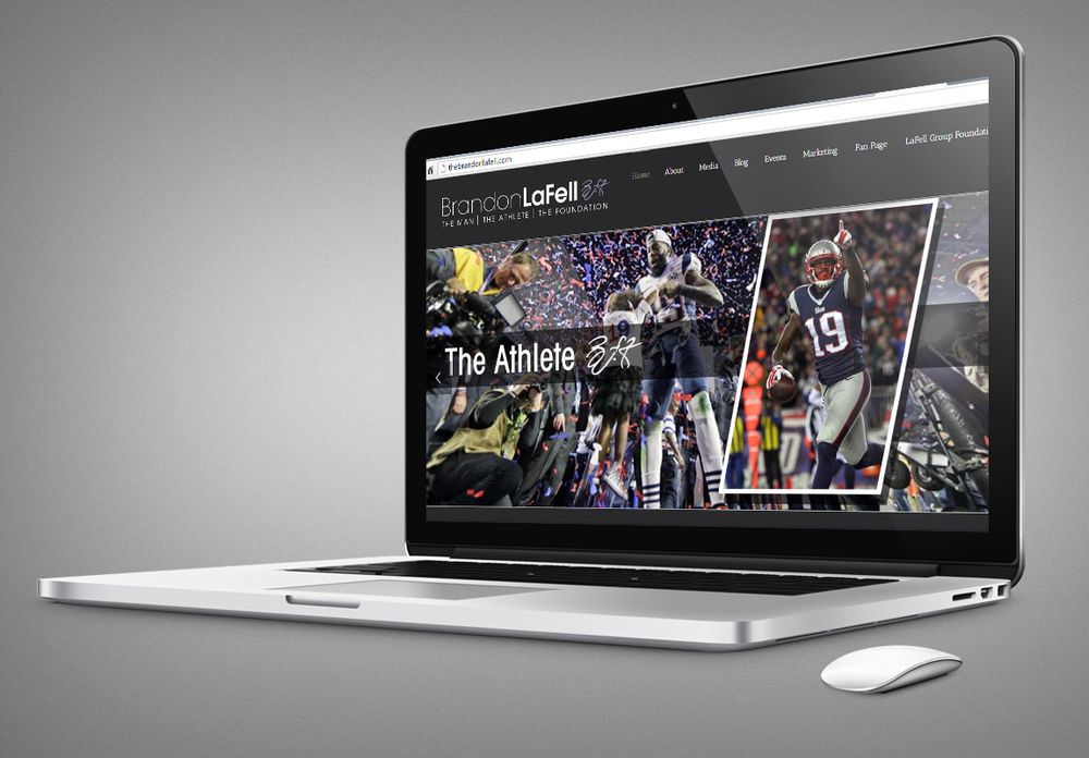 Laptop displaying a sports website with football game imagery and statistics.