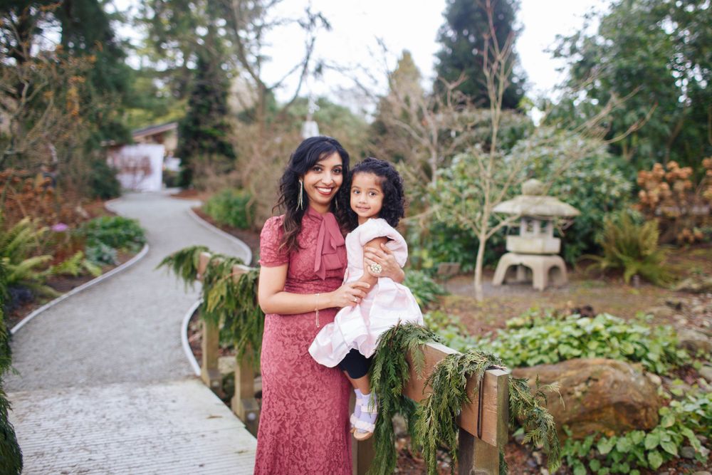 Edmonds family photographer: A mother and her daughter pose for a portrait on a wooden bridge at the Evergreen Arboretum in Everett WA