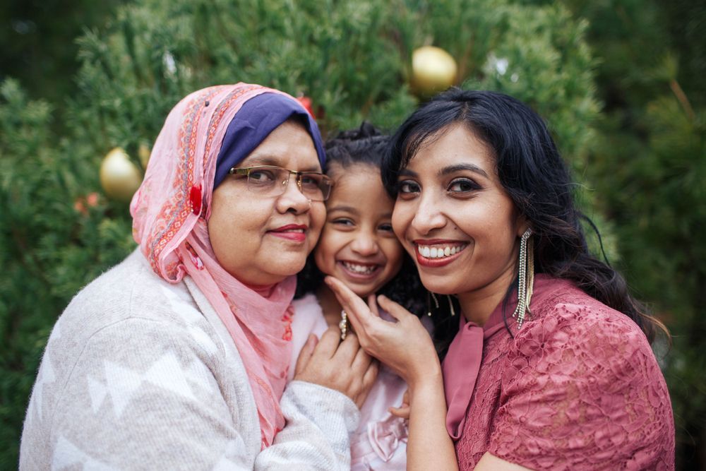 Seattle extended family session: A grandmother, grand-daughter and daughter pose for a 3 generation photo outdoors in Everett WA