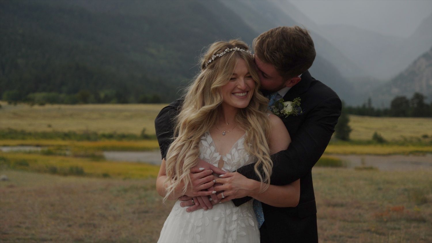 Intimate wedding moment captured in mountain valley in Rocky Mountain National Park.