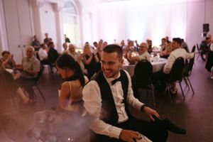 Wedding celebration in full swing with guests enjoying the festive atmosphere.