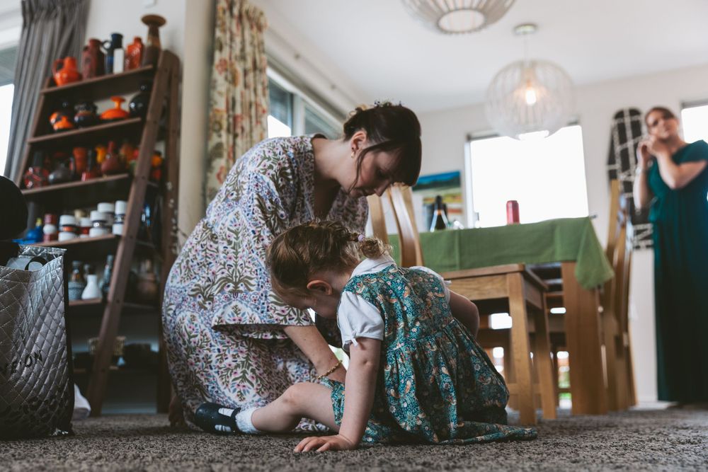 Tender moment shared during wedding day preparations.