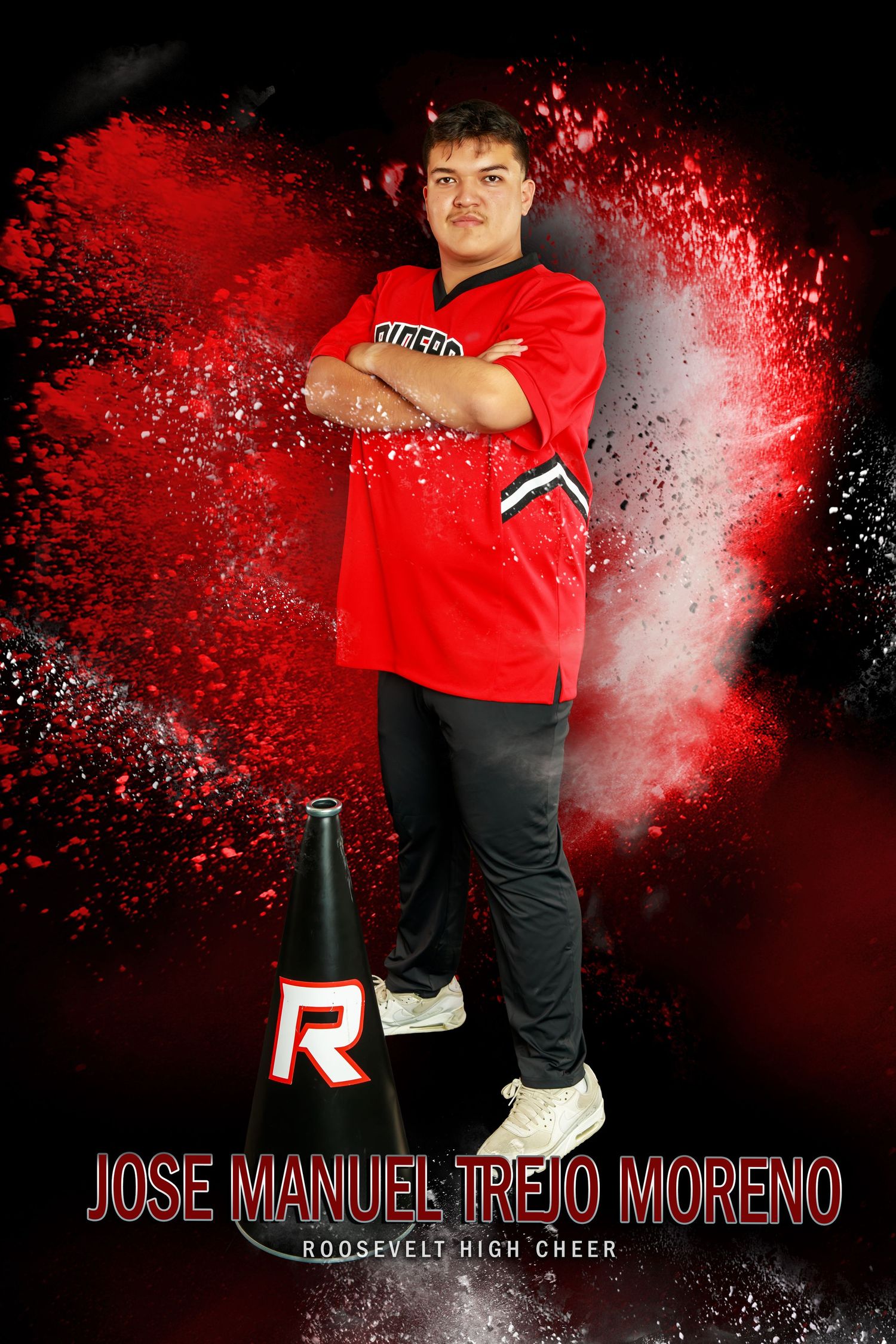 Cheerleader in dark uniform leaps through dramatic gold powder explosion effect against black background.