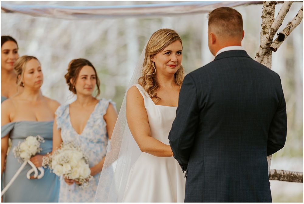 Bride and groom exchanging vows at their White Mountain wedding