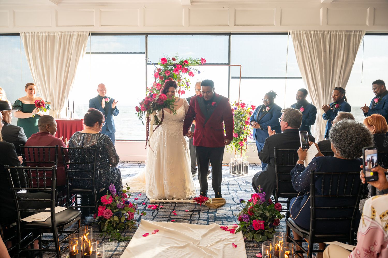 Ceremony setup at Oxford Exchange with floral arches and soft candlelight, captured by a Tampa wedding photographer with editorial flair.