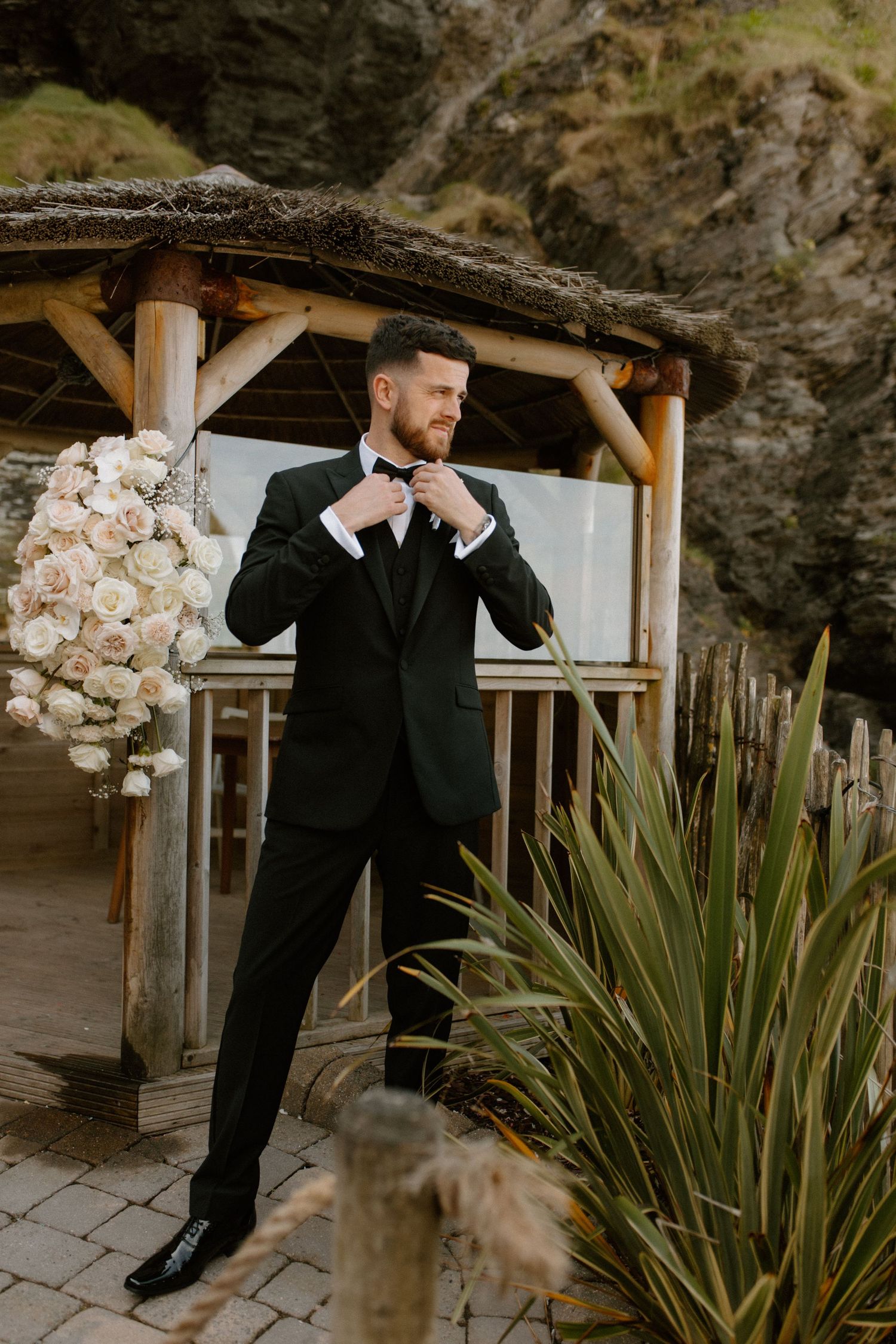 Groom in a tuxedo at luxury Devon beach wedding