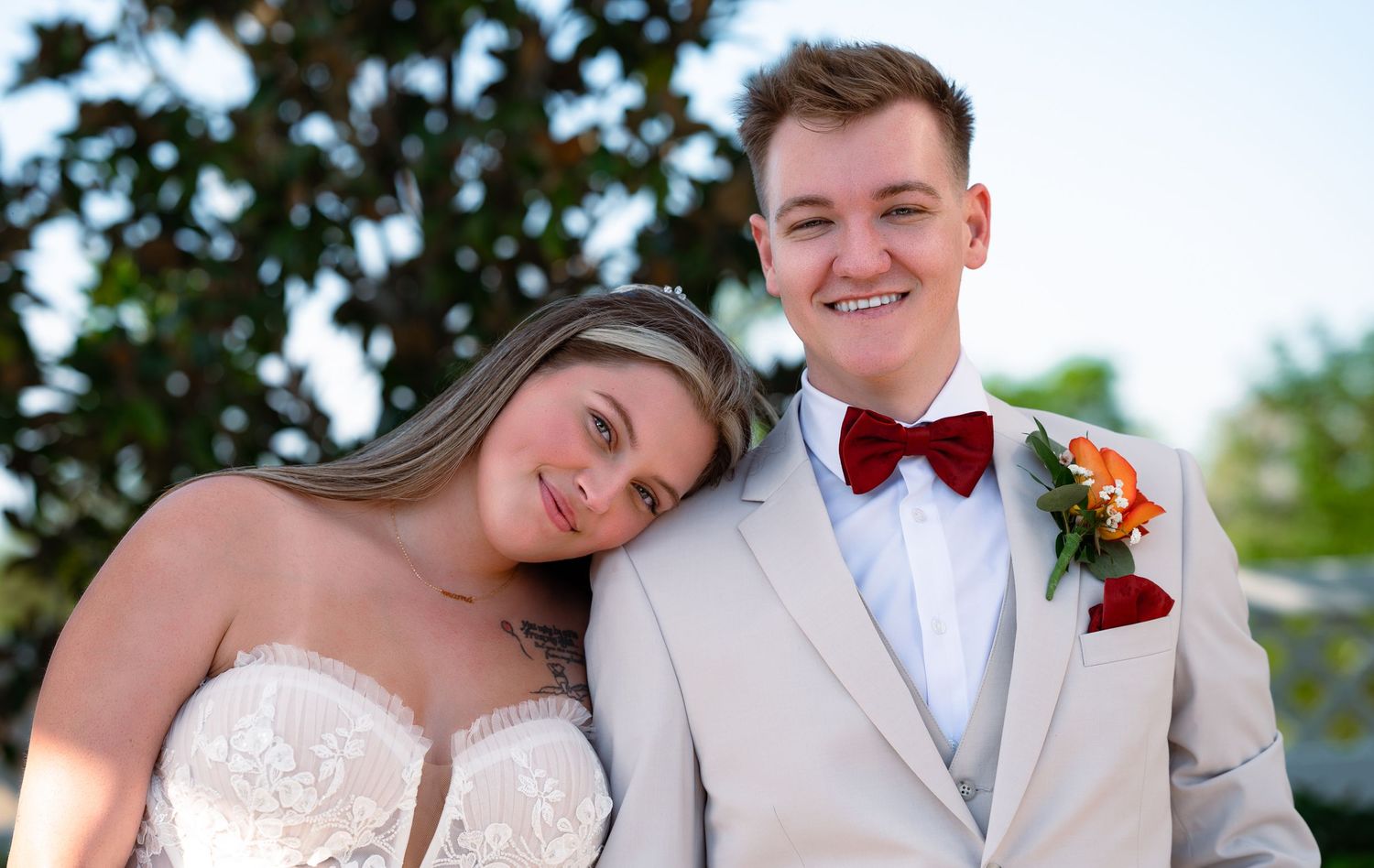 Wellington wedding photographers capturing a candid first look outside rustic venue.
