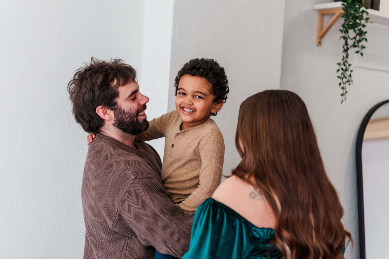 Family with autistic child smiling for photos in Pittsburgh