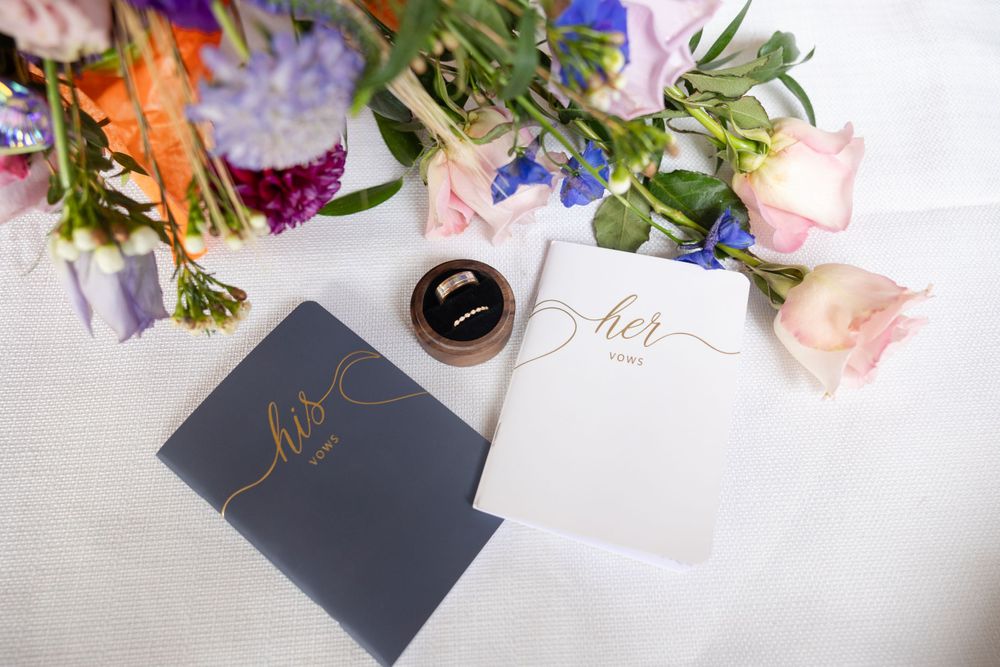 Detail shot with rings vow book and flowers, Chico Wedding Photographer, Northern California Wedding Photographer