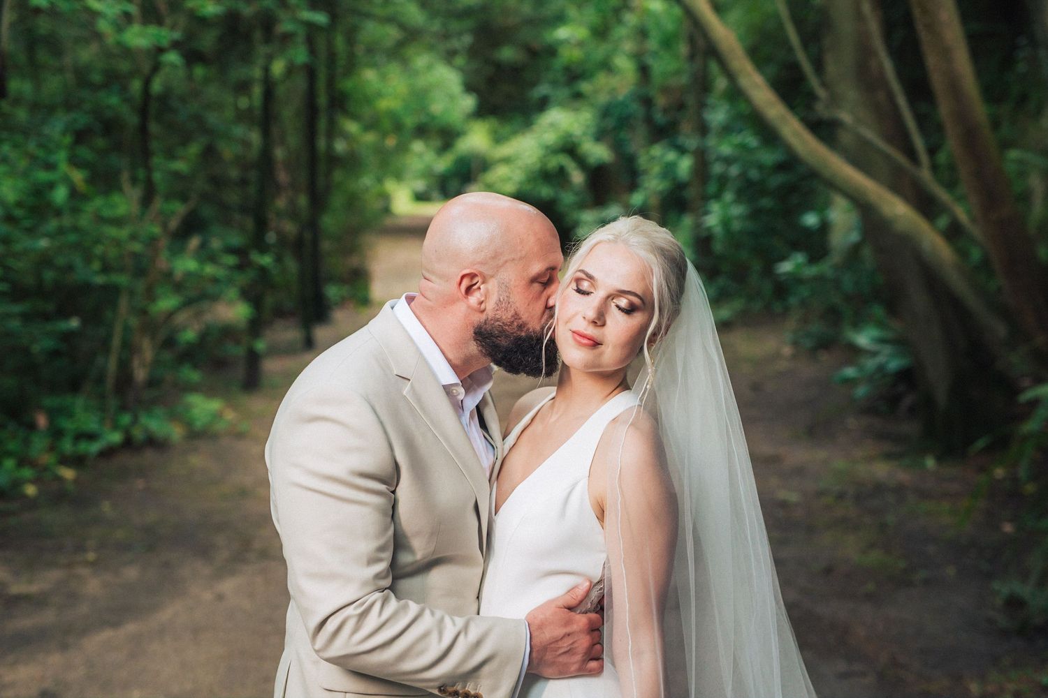 Bride & groom at Casa dos Penedos, a wedding venue from Penha Longa Catering. A romantic moment captured by a Portugal wedding photographer.