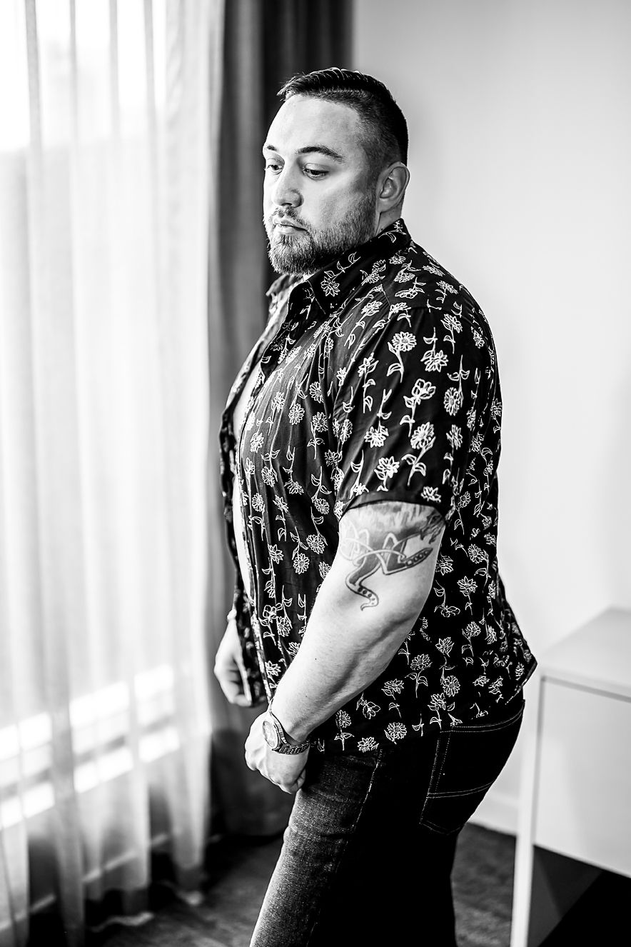 Black and white portrait sequence showing someone in a patterned short sleeve button-up shirt against a bright window.
