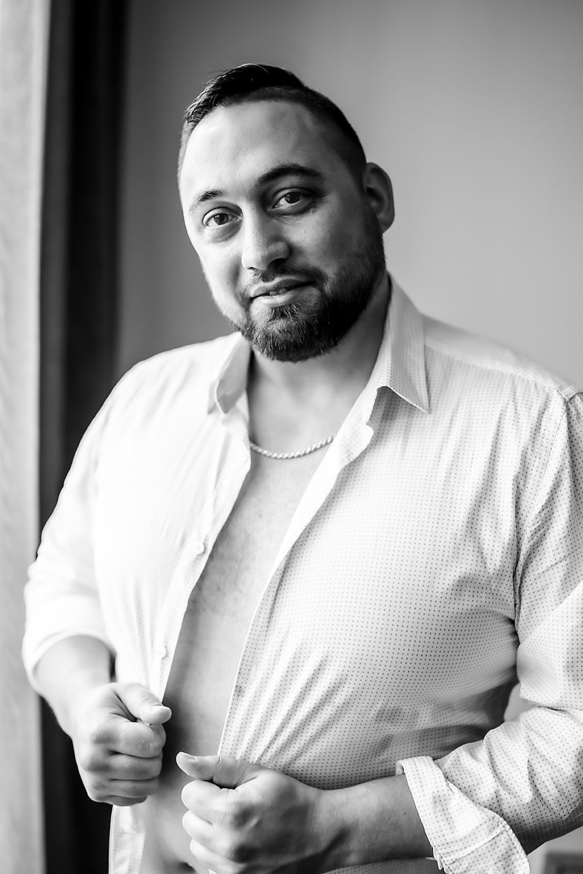 Professional black and white portraits showing a person in a white shirt with warm expressions and various poses.