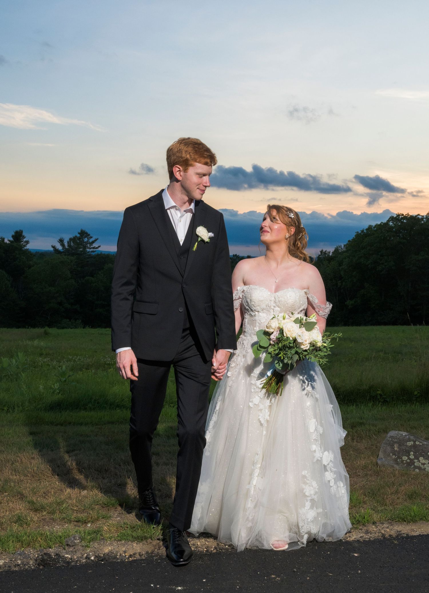 A romantic couple embraces in a field at sunset creating silhouettes across multiple photos.