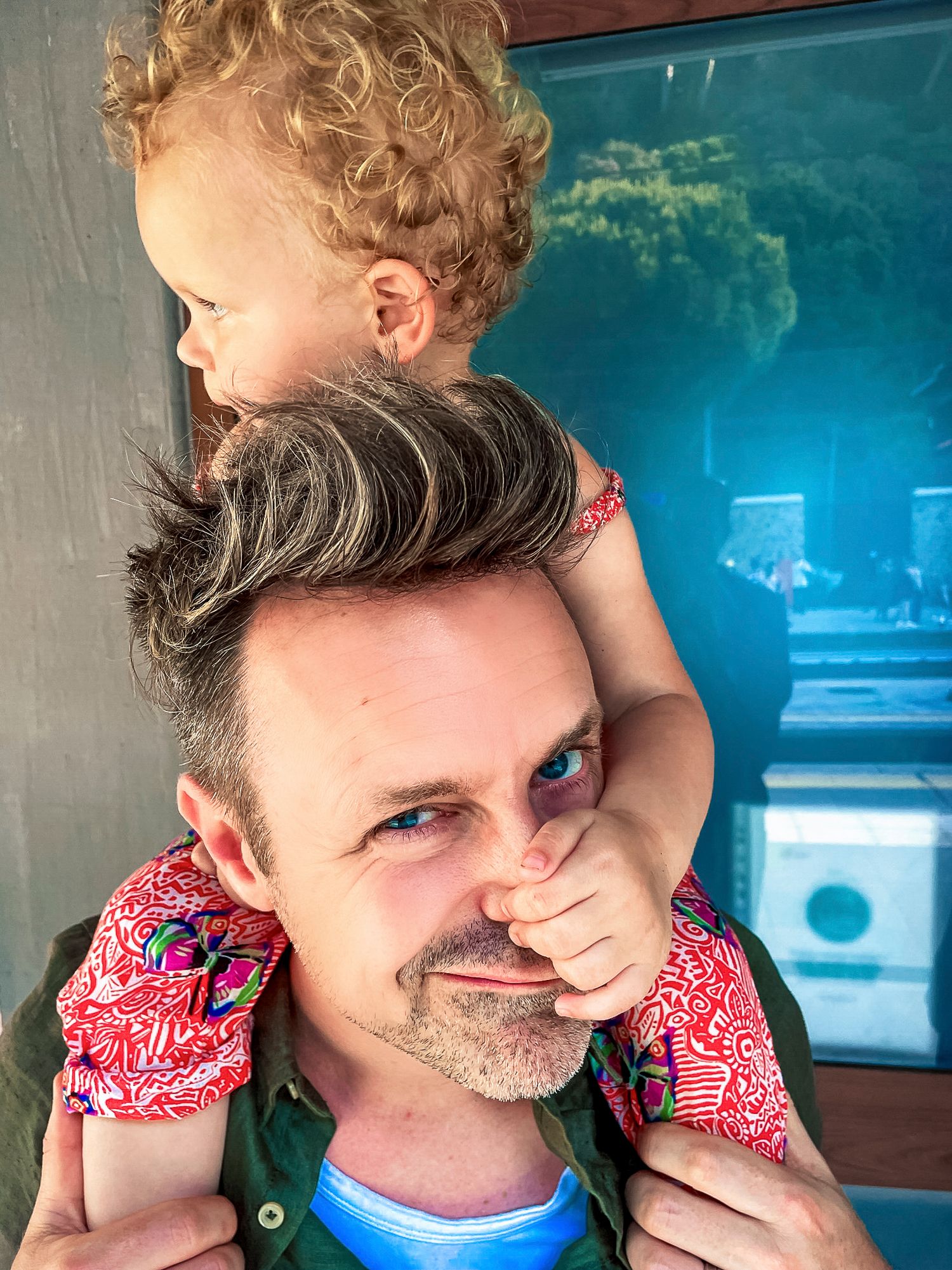 A playful moment captured with joyful expressions and summer vibes.