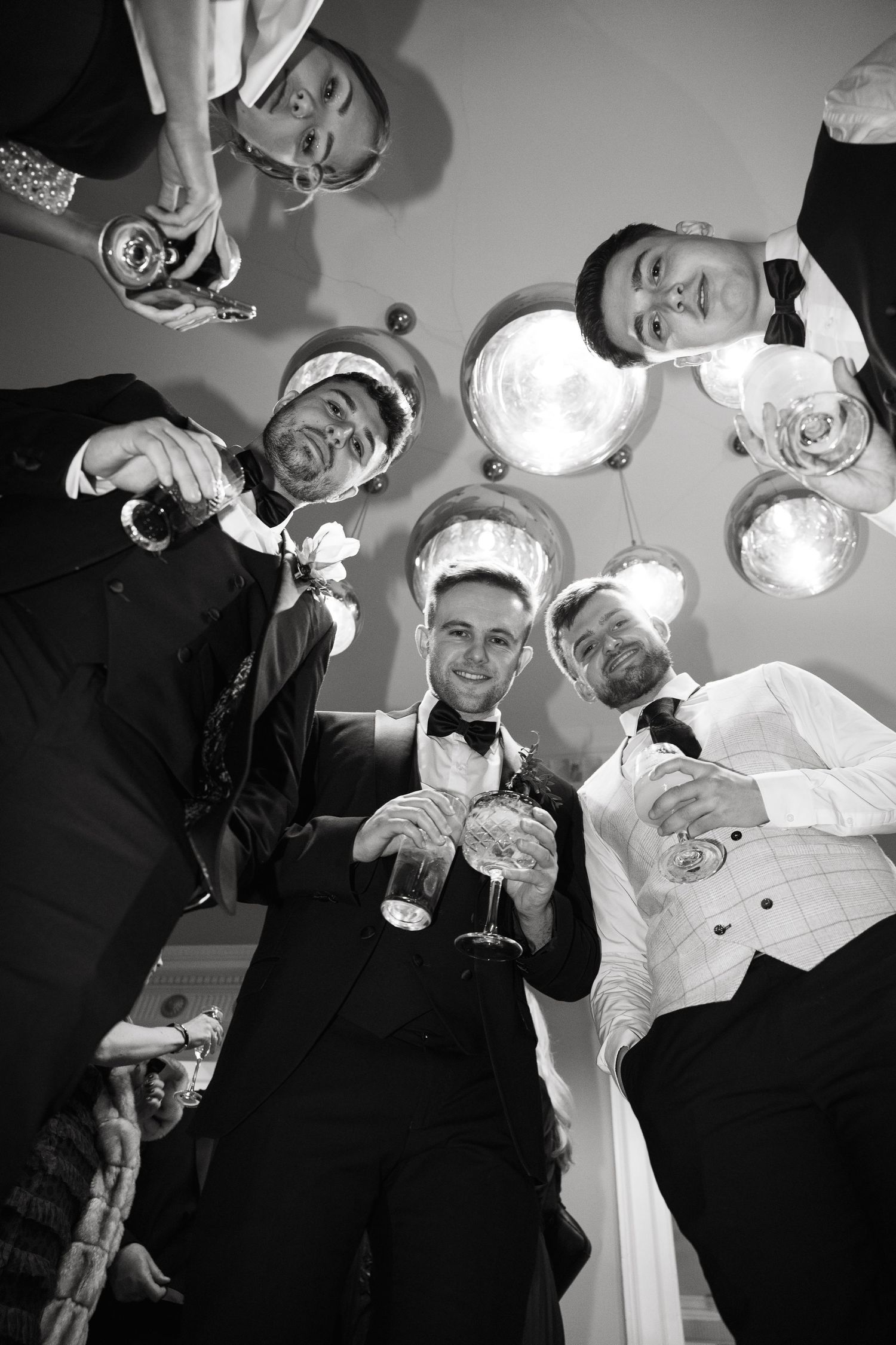 Creative low-angle party photo sequence showing celebratory toasts and champagne glasses.