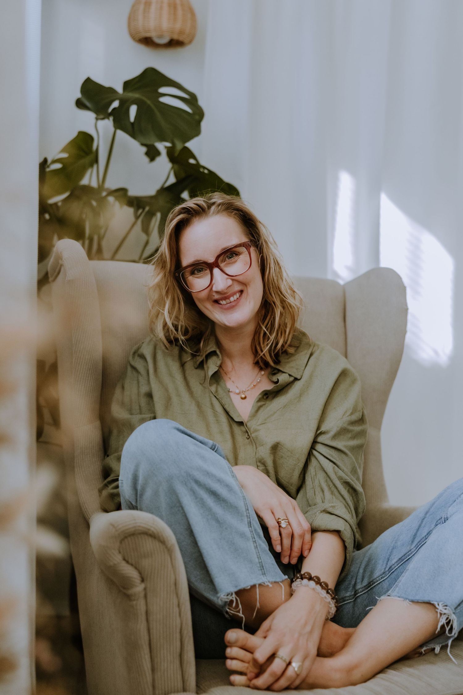 Lifestyle photo in neutral tones with monstera plant and natural window light.