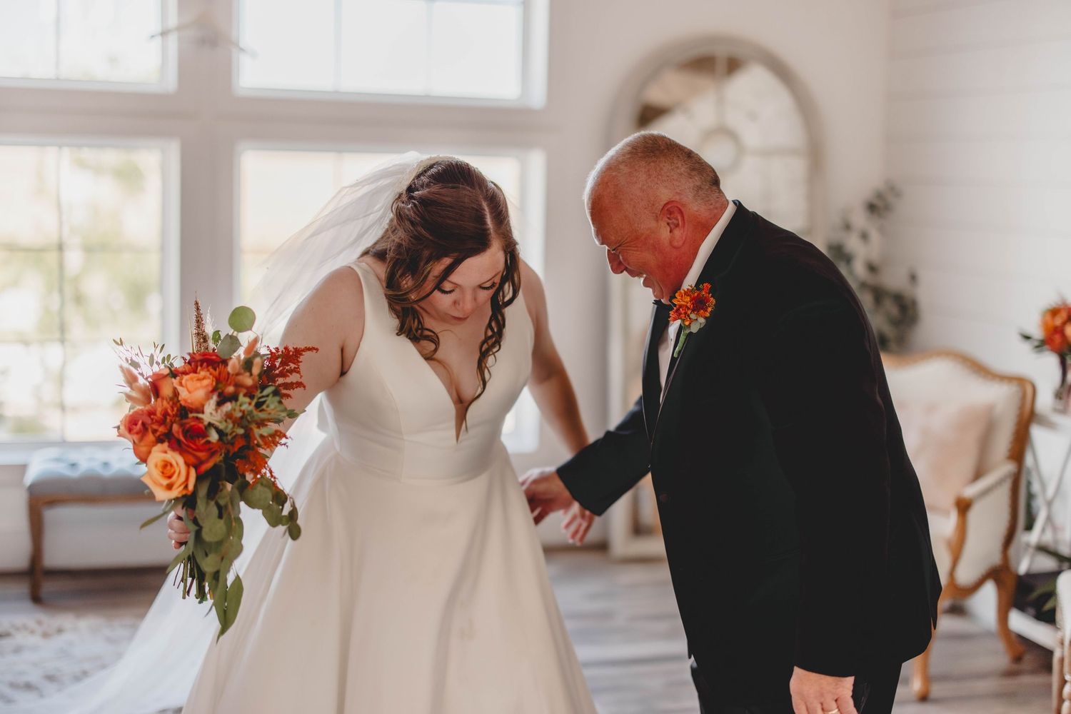 A series of candid first look reactions captured in a bright indoor wedding venue.