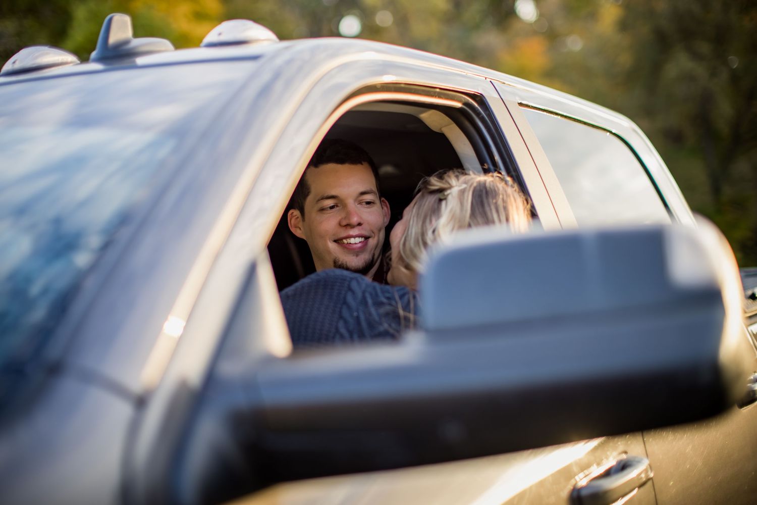 Candid car interior shot with natural lighting and bokeh effects.