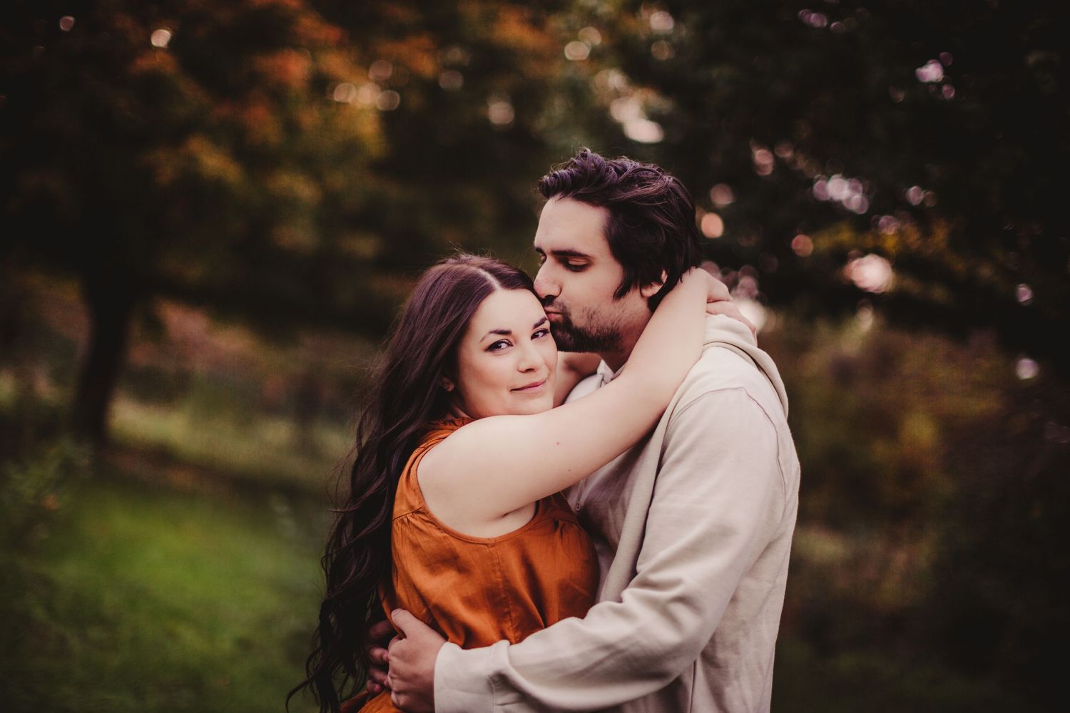 Artistic portrait session with warm autumn tones and natural lighting.