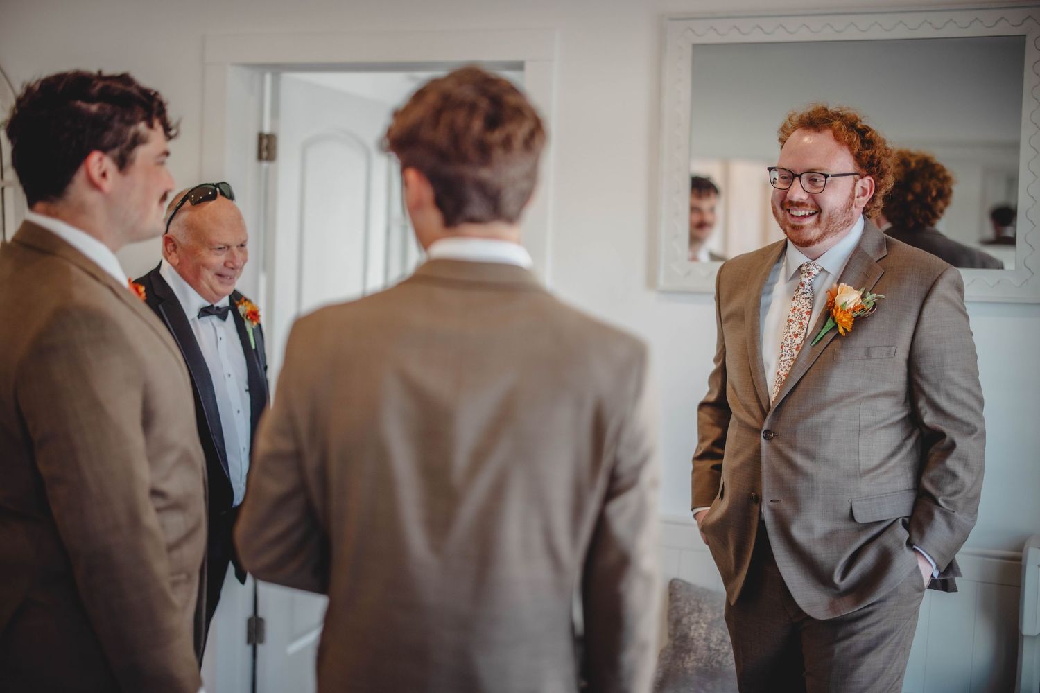 Groomsmen share a laughing moment before the wedding ceremony.