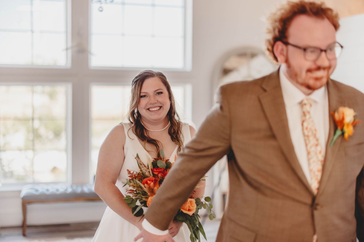 A first look sequence showing emotional moments between a couple in formal wedding attire.